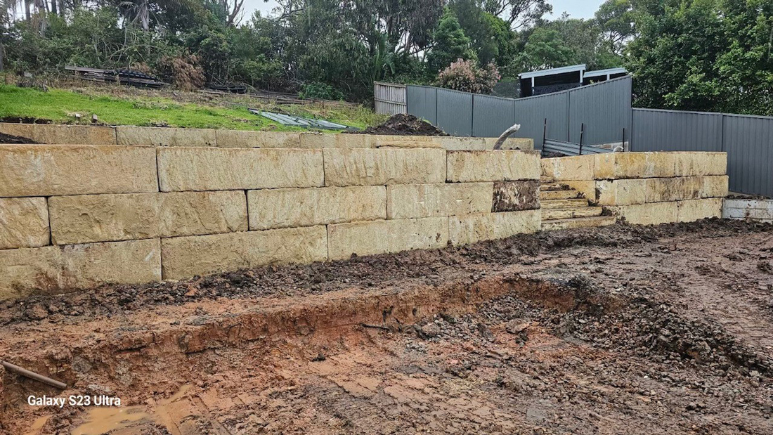 Sandstone boulder wall Parklea sand and soil